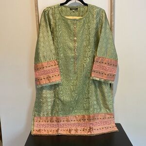 Green and pink kurti with gold pants.
